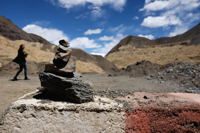 View of rock formation on mountain against sky