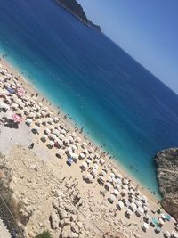 Scenic view of beach against blue sky