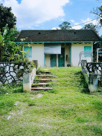 View of lawn with buildings in background