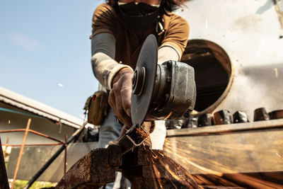 Low section of man working at construction site