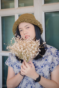 Portrait of young woman looking away