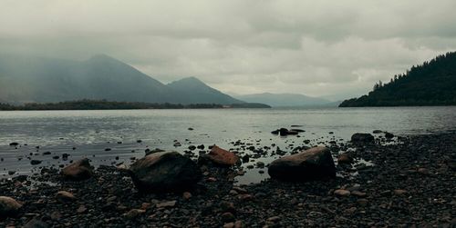 Scenic view of sea against cloudy sky