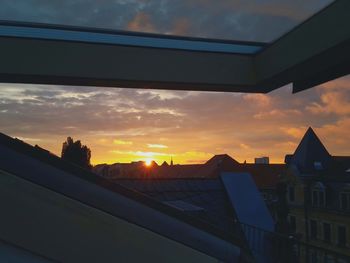 Low angle view of built structure at sunset