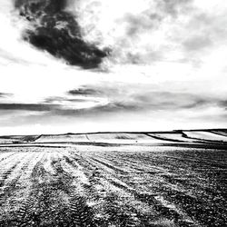 Scenic view of landscape against cloudy sky