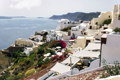 High angle view of buildings in town against sky