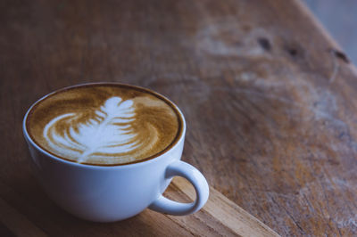 Close-up of cappuccino on table