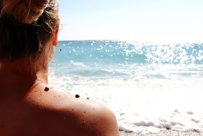 Rear view of women at beach 