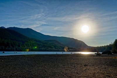 Scenic view of beach against sky during sunset