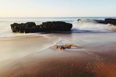 Scenic view of sea against clear sky