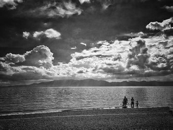 Scenic view of sea against cloudy sky