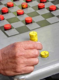 High angle view of man preparing chess pieces