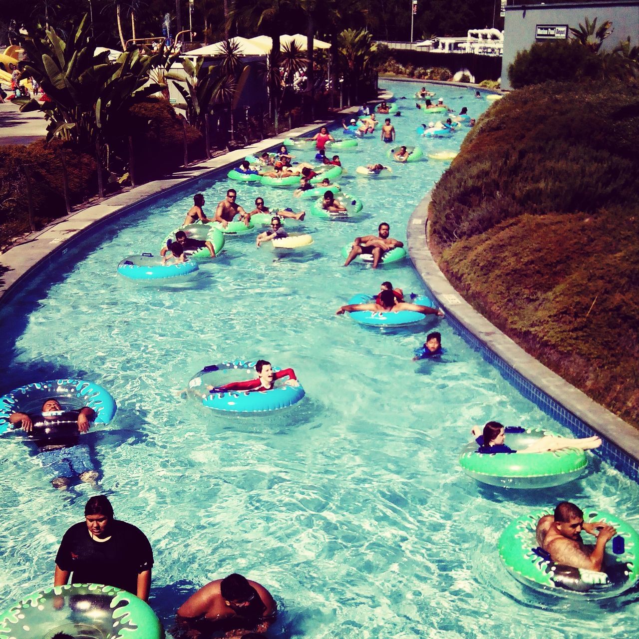 lifestyles, leisure activity, water, beach, vacations, large group of people, high angle view, enjoyment, person, sea, togetherness, sand, shore, men, fun, weekend activities, mixed age range, relaxation, summer