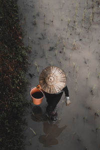 High angle view of farmer walking in farm