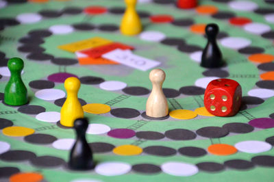 Multi colored tokens and dice on table