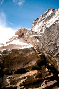 Low angle view of rock formations against sky