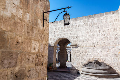 Gas light hanging in courtyard at historic centre of arequipa