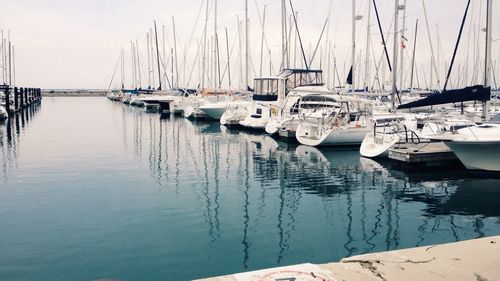 Boats moored at harbor