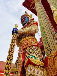 Low angle view of statue against sky