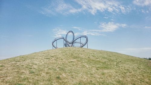 Low angle view of tiger and turtle - magic mountain against sky