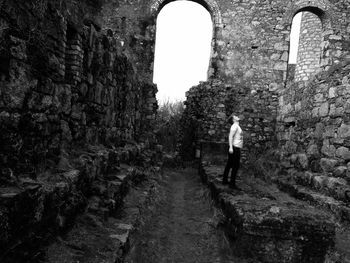 Man standing in old ruin