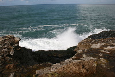 Waves splashing on rocks