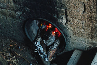 High angle view of fire on wood