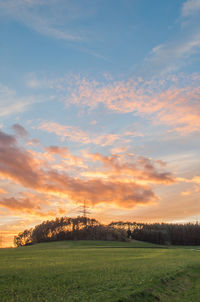 Scenic view of landscape against dramatic sky