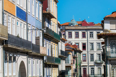 Low angle view of buildings against blue sky