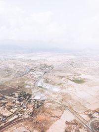 High angle view of city against cloudy sky