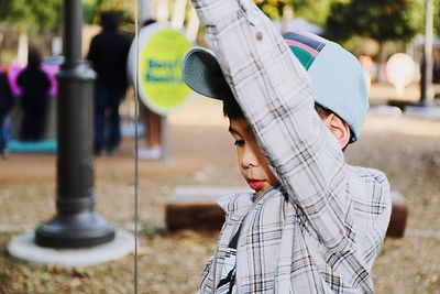 Close-up portrait of young woman standing outdoors