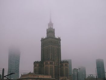 Buildings in city against sky