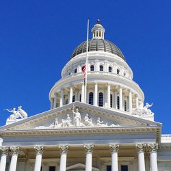 Low angle view of building against blue sky