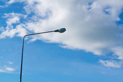 Low angle view of street light against sky