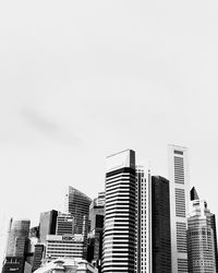 Low angle view of skyscrapers against clear sky