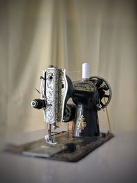 Close-up of machine part on table