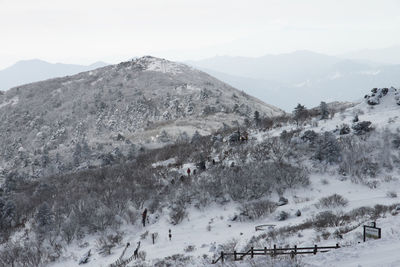 Scenic view of mountains against sky during winter