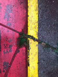 High angle view of yellow umbrella on road