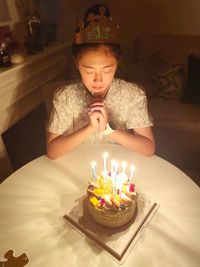 Close-up of illuminated candles on table