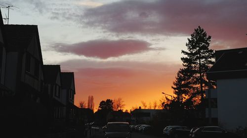 Silhouette buildings against sky during sunset