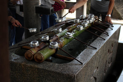 High angle view of people performing religious worship at temple