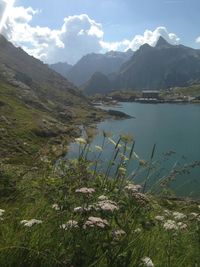 Scenic view of lake and mountains against sky