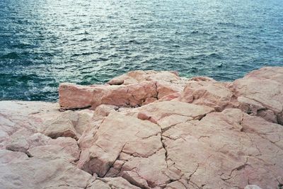 High angle view of rock formation in sea