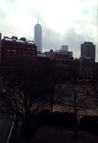 Silhouette of buildings against cloudy sky