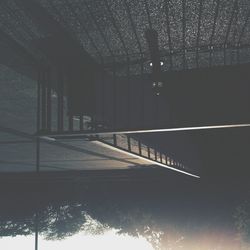 Low angle view of illuminated bridge at night