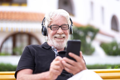 Portrait of man using mobile phone