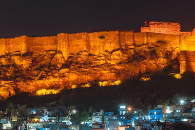 Illuminated buildings in city at night