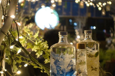 Close-up of wine glass bottles on table