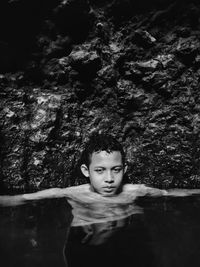 Portrait of boy swimming in water