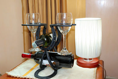 Close-up of wine glasses on table at home