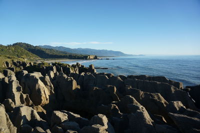 Scenic view of sea against clear blue sky